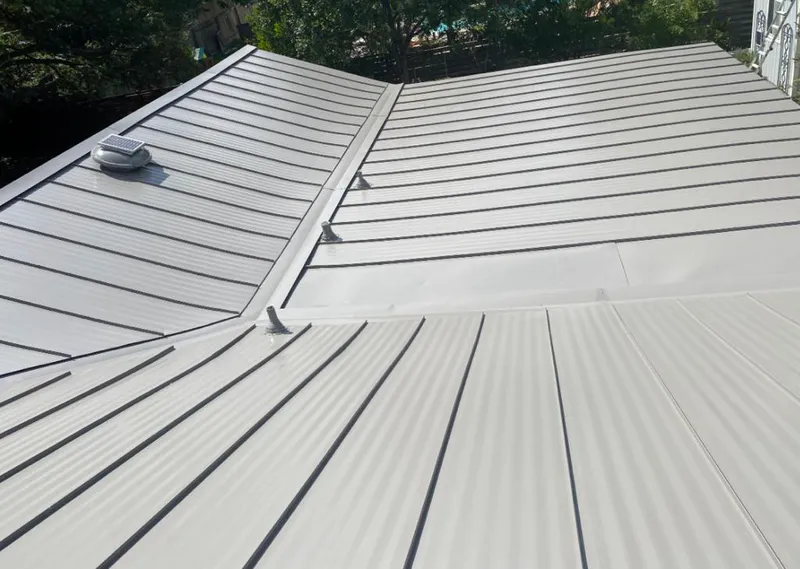 Solar attic fan installed on a metal roof for Roof Ventilation in Pontoon Beach